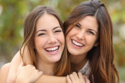 woman smiling about the cost of cosmetic dentistry in Syracuse