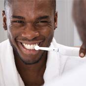 Man brushing his teeth to prevent toothache in Syracuse