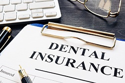 Dental insurance paperwork for the cost of dental implants in Syracuse