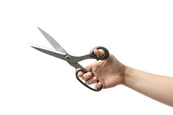 hand holding scissors