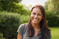 smiling young woman outside 