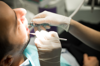 relaxed man recieving root canal therapy