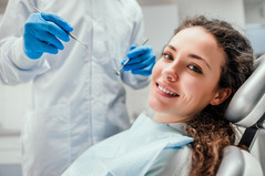 patient smiling while visiting dentist