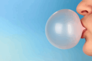 Close up of someone blowing a bubblegum bubble